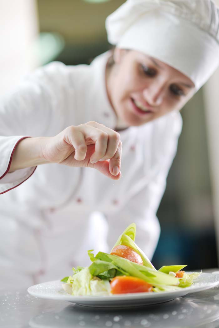 Chef plating a meal